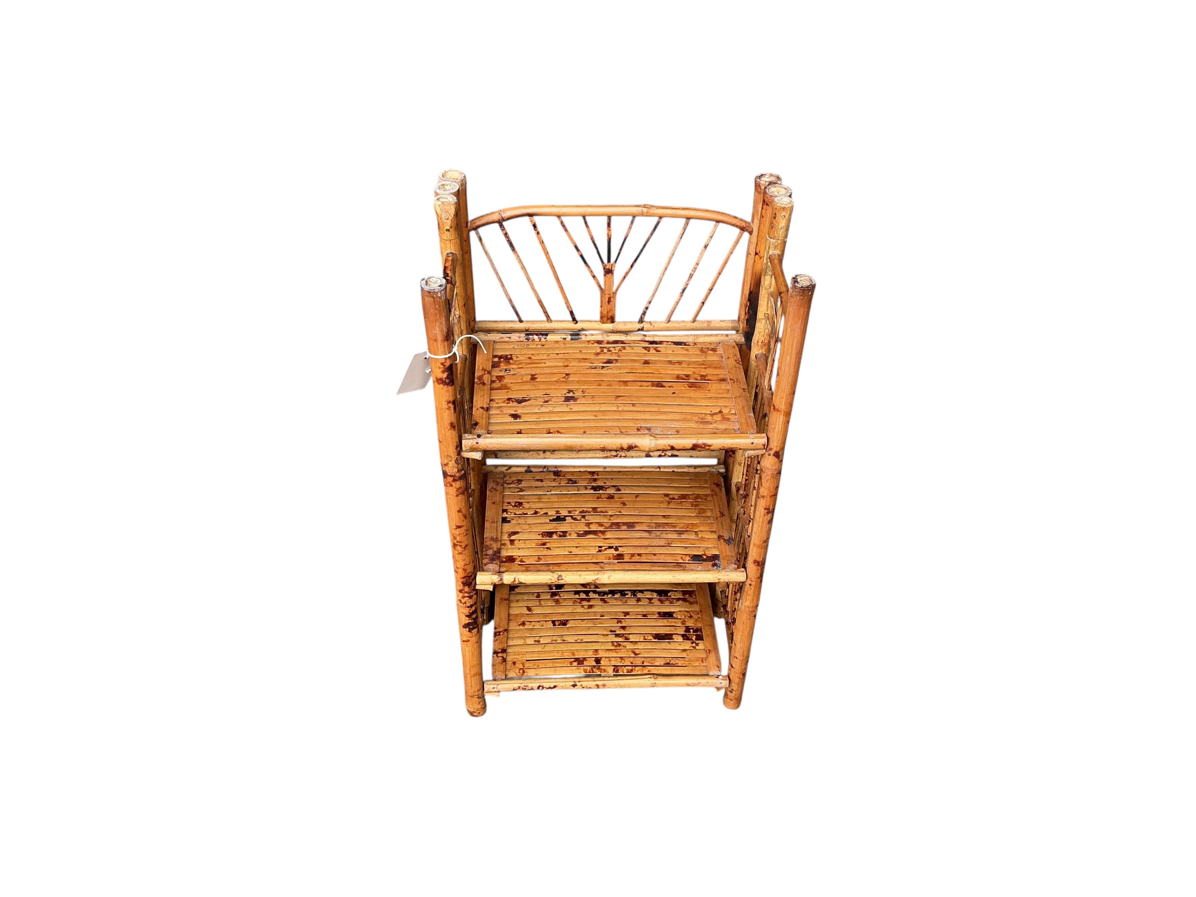 A folding bamboo open shelf unit, width 36cm, depth 23cm, height 66cm
